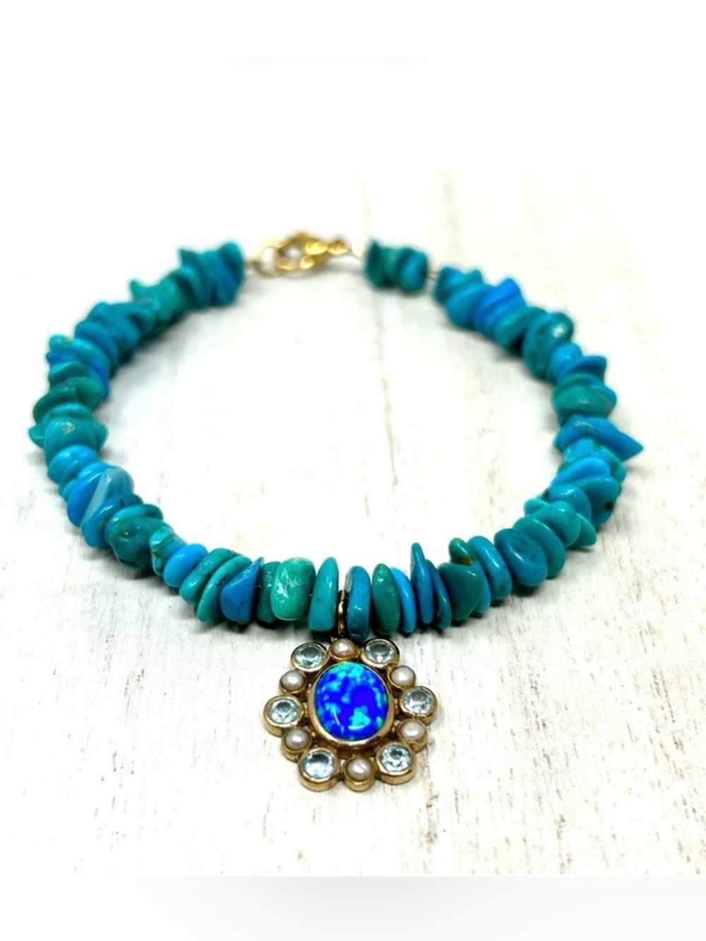 14K floral pendant, turquoise beaded bracelet